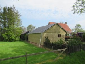 Houten berging achterkant HGG-10 in Steenwijkerwold